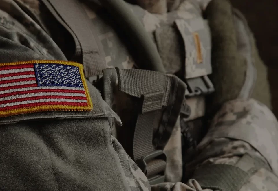 A close up of the back of an army uniform.